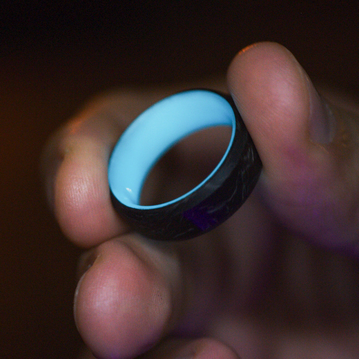 The F1 Carbon Fiber Lume Ring worn on hand