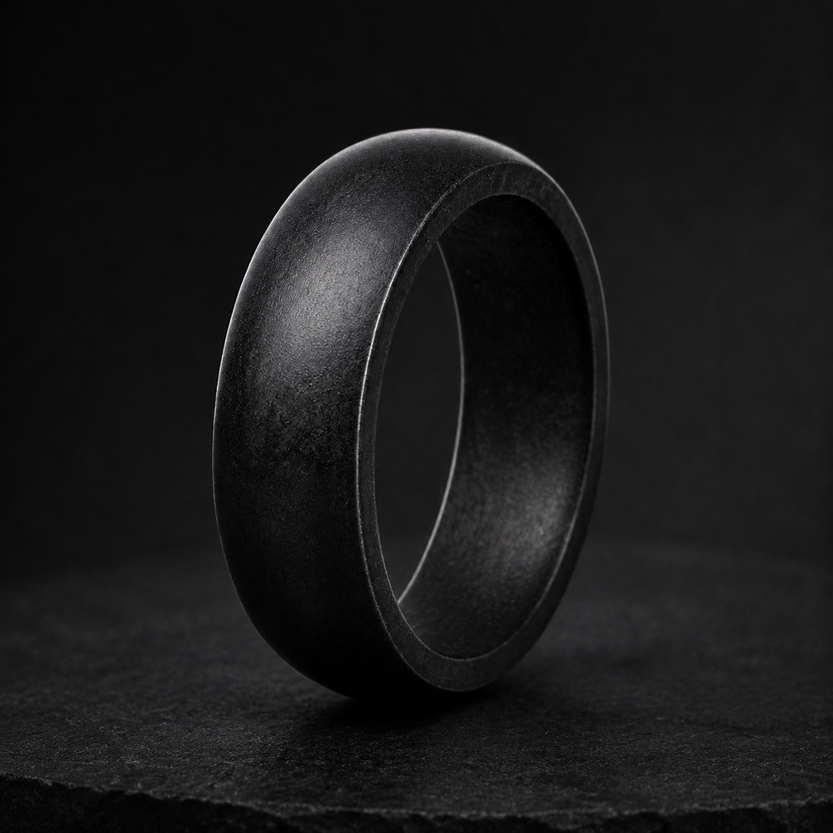 Afterdark Halo dark charcoal glow ring in dramatic studio lighting