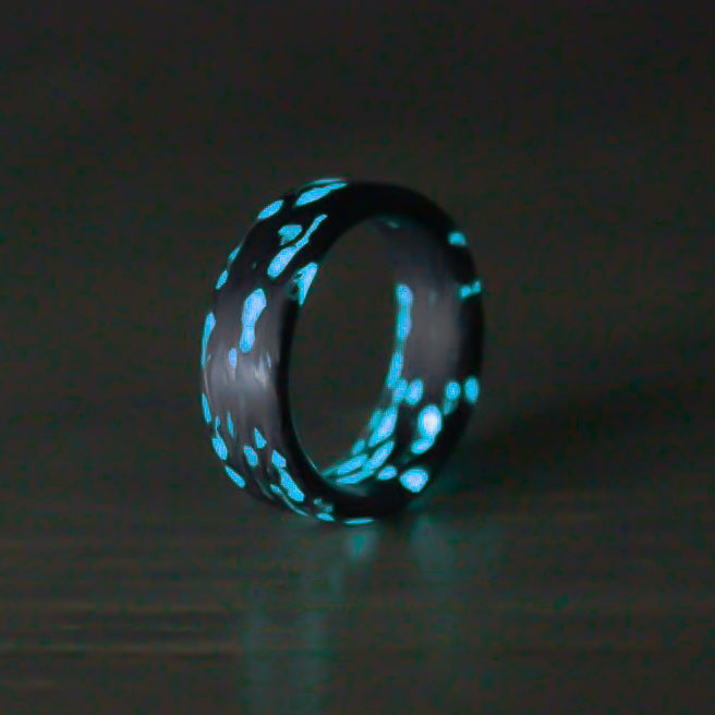 Alien Blue Carbon Fiber Glow Ring from an angled product view