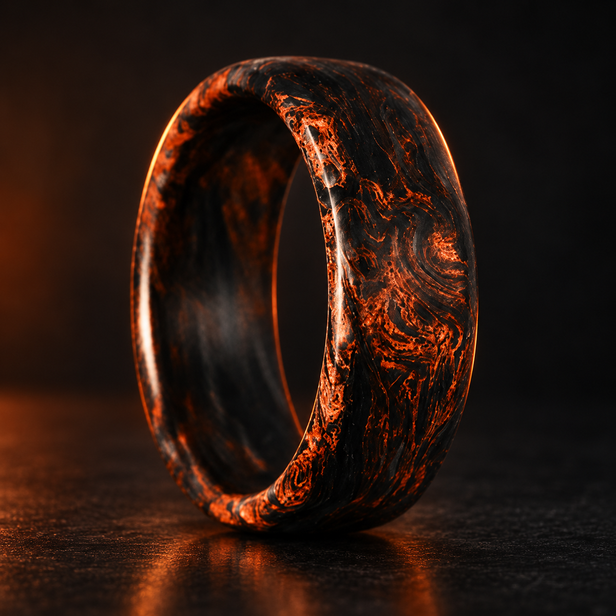 Carbon Storm Ignition forged carbon fiber ring on a dark studio background