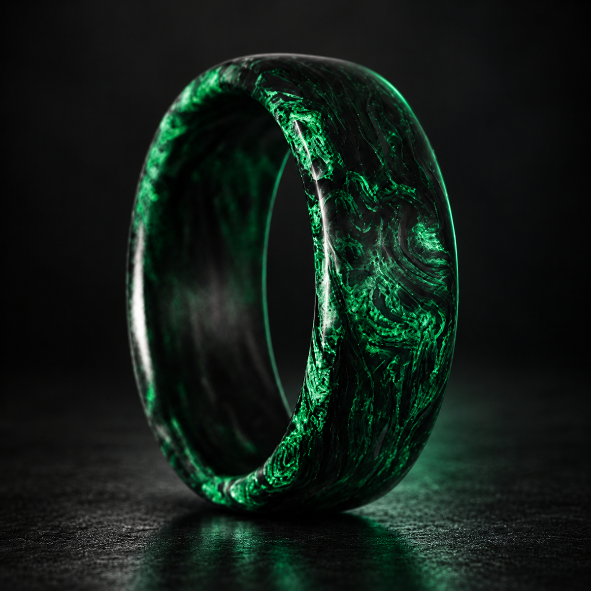 Carbon Storm Venom forged carbon fiber ring on a dark studio background