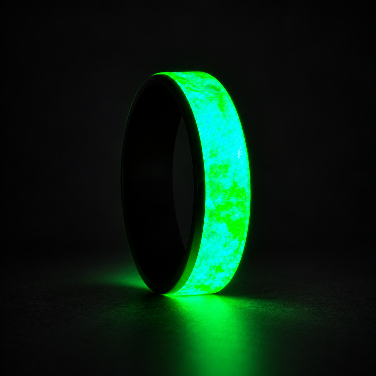 The Earth Ring glowing vivid green on a dark studio background