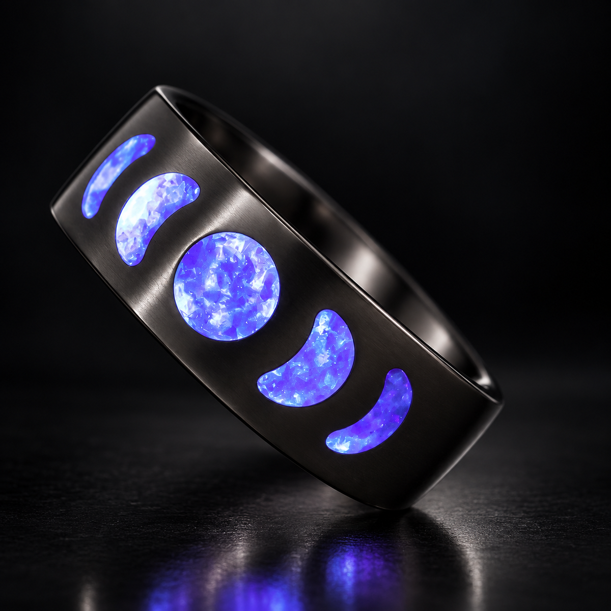 Moon Phase Amethyst glowing ring on a dark studio background