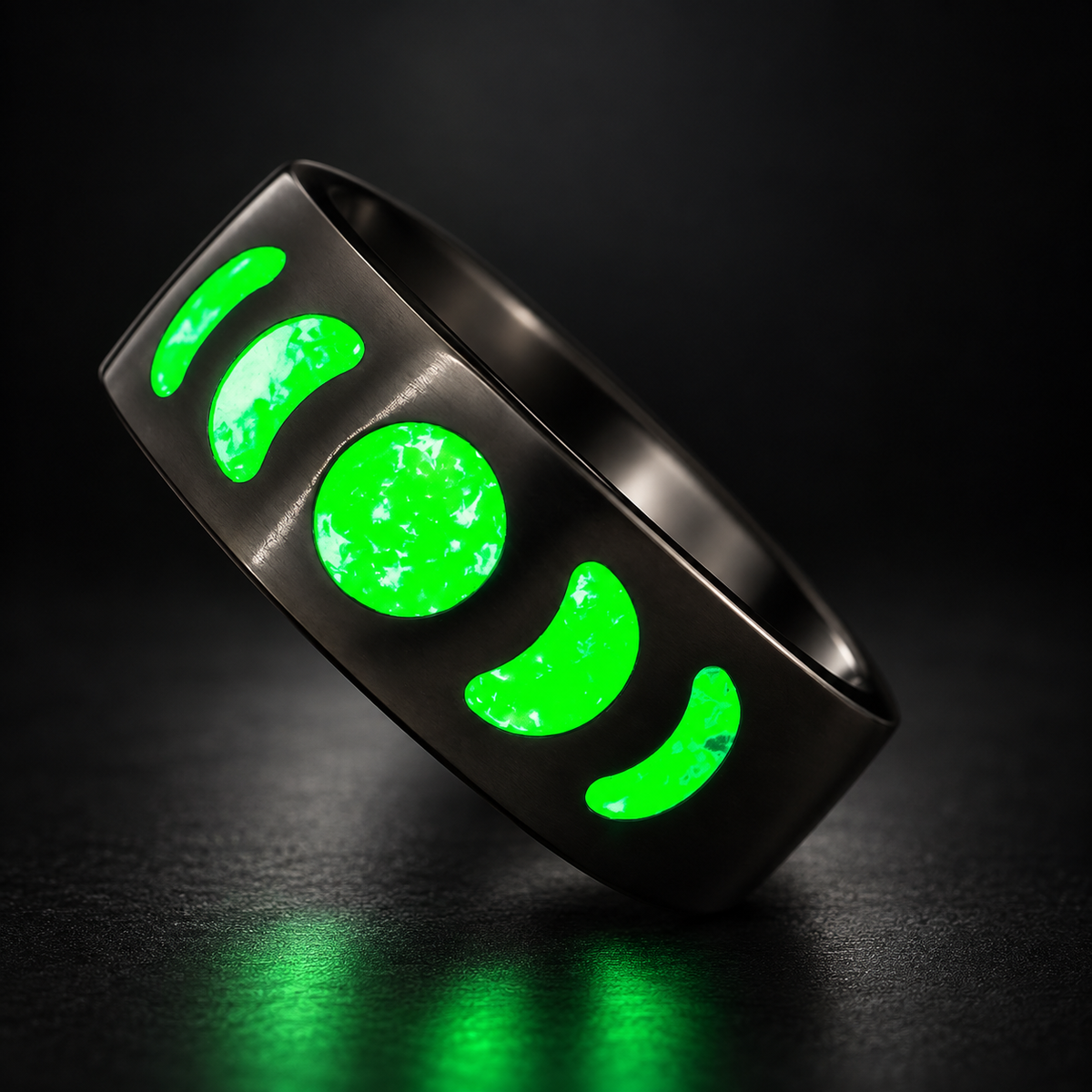 Moon Phase Emerald glowing ring on a dark studio background