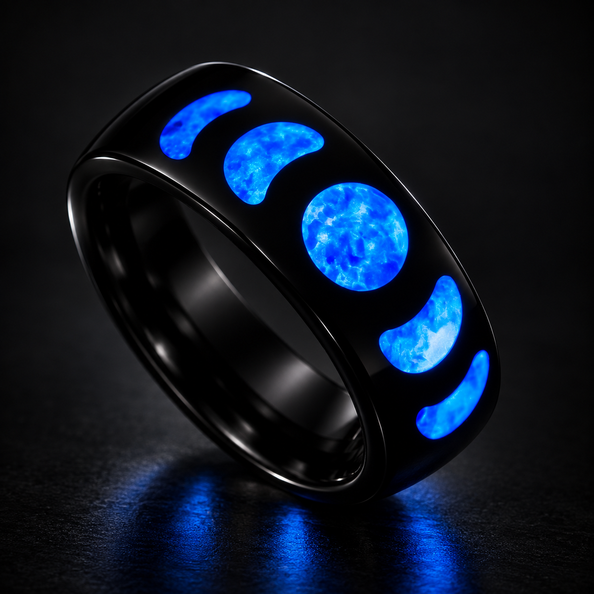 Moon Phase Nereus glowing blue ring on a dark studio background