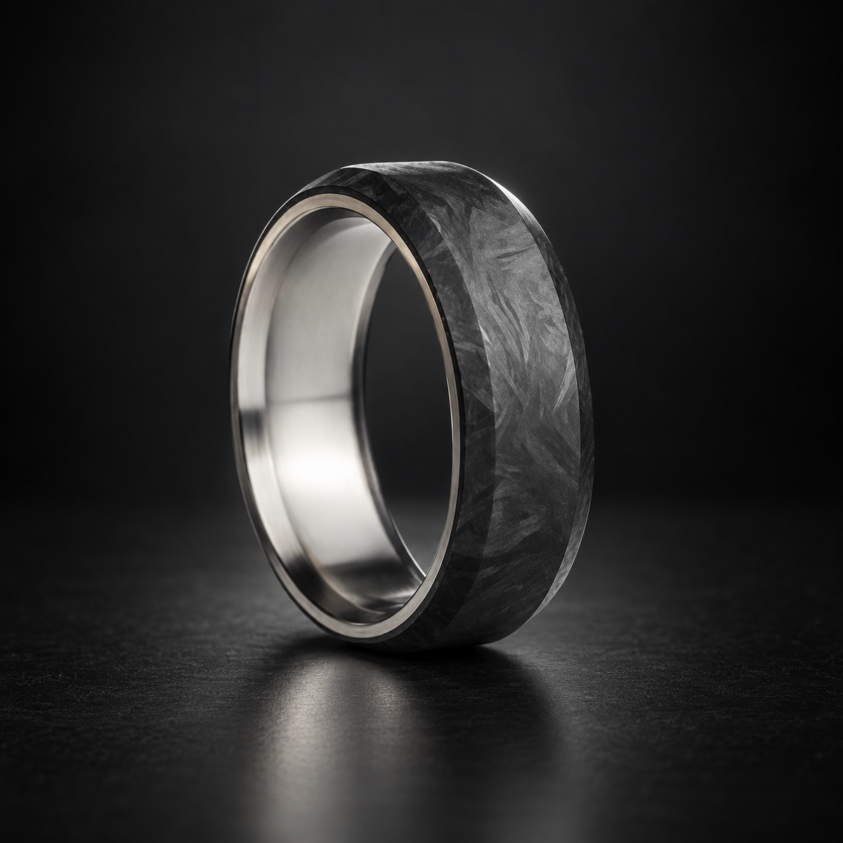 Titan Forge handcrafted forged carbon fiber and titanium ring on a dark studio background